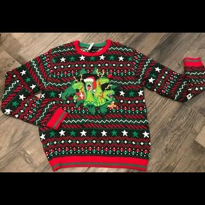 “Ugly” Christmas sweater. Dinosaurs Blizzard Bay